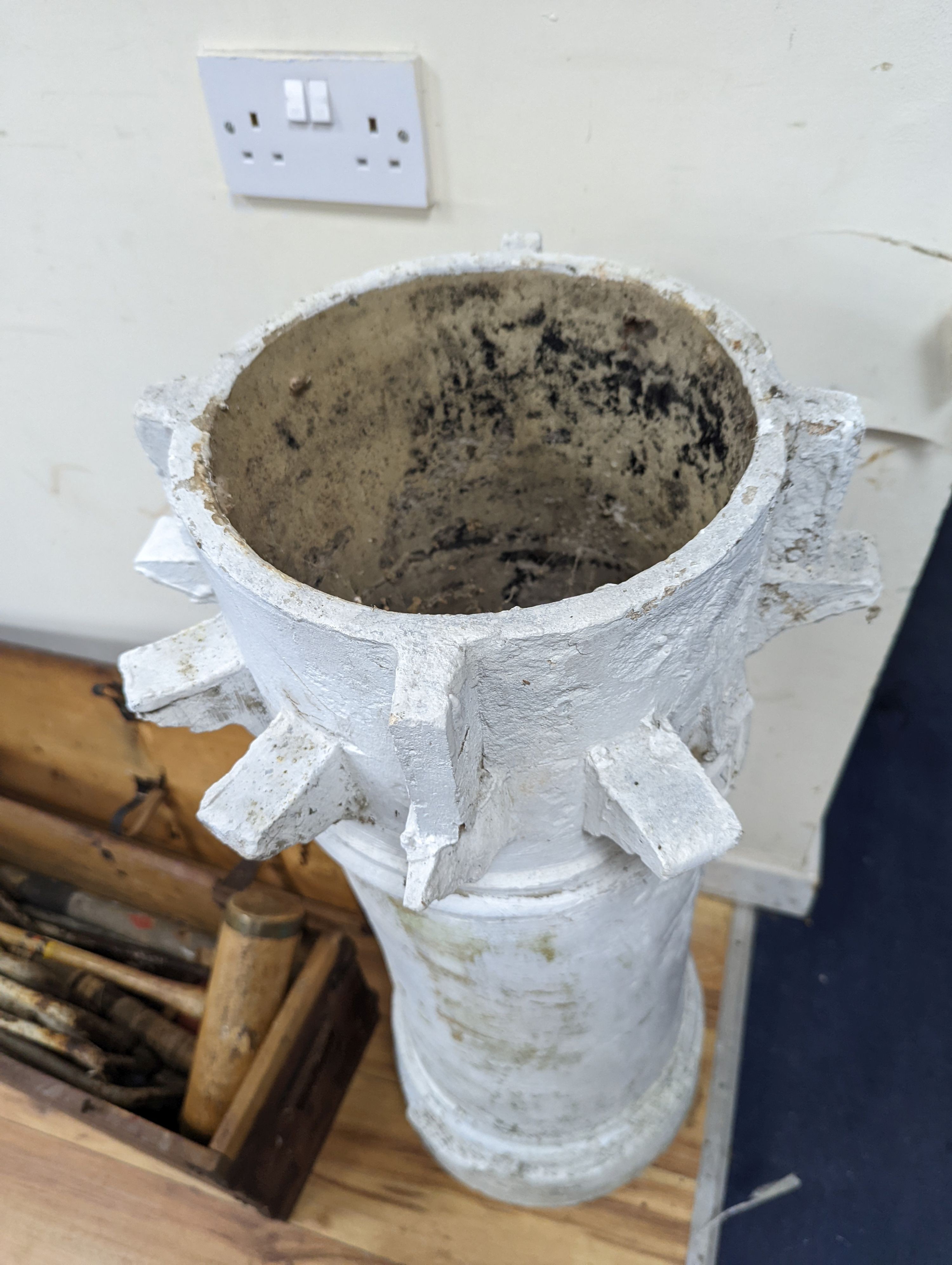 A white painted terracotta chimney pot, height 88cm